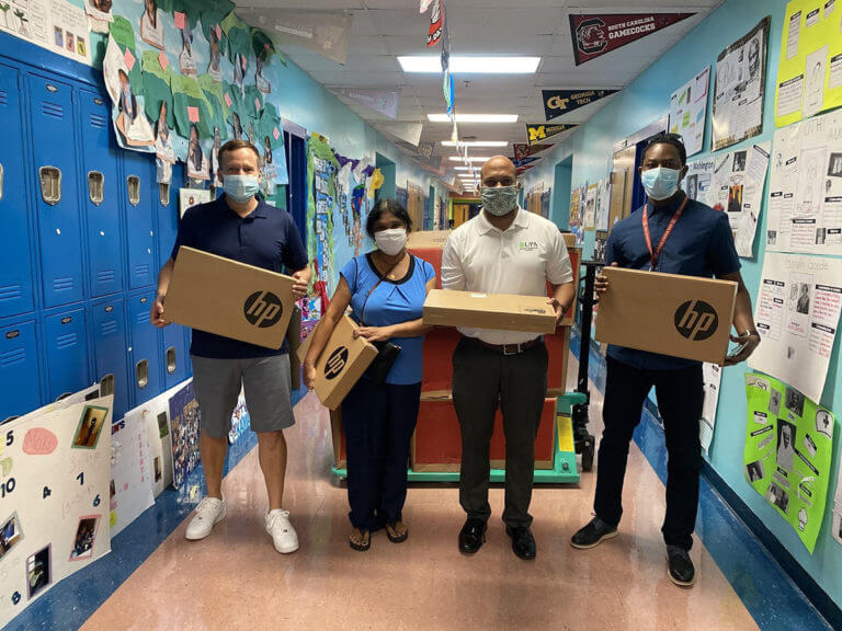 Infinity Sales Group Donates Laptops to West Palm Beach School